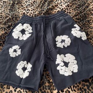 Black and white denim tear shorts